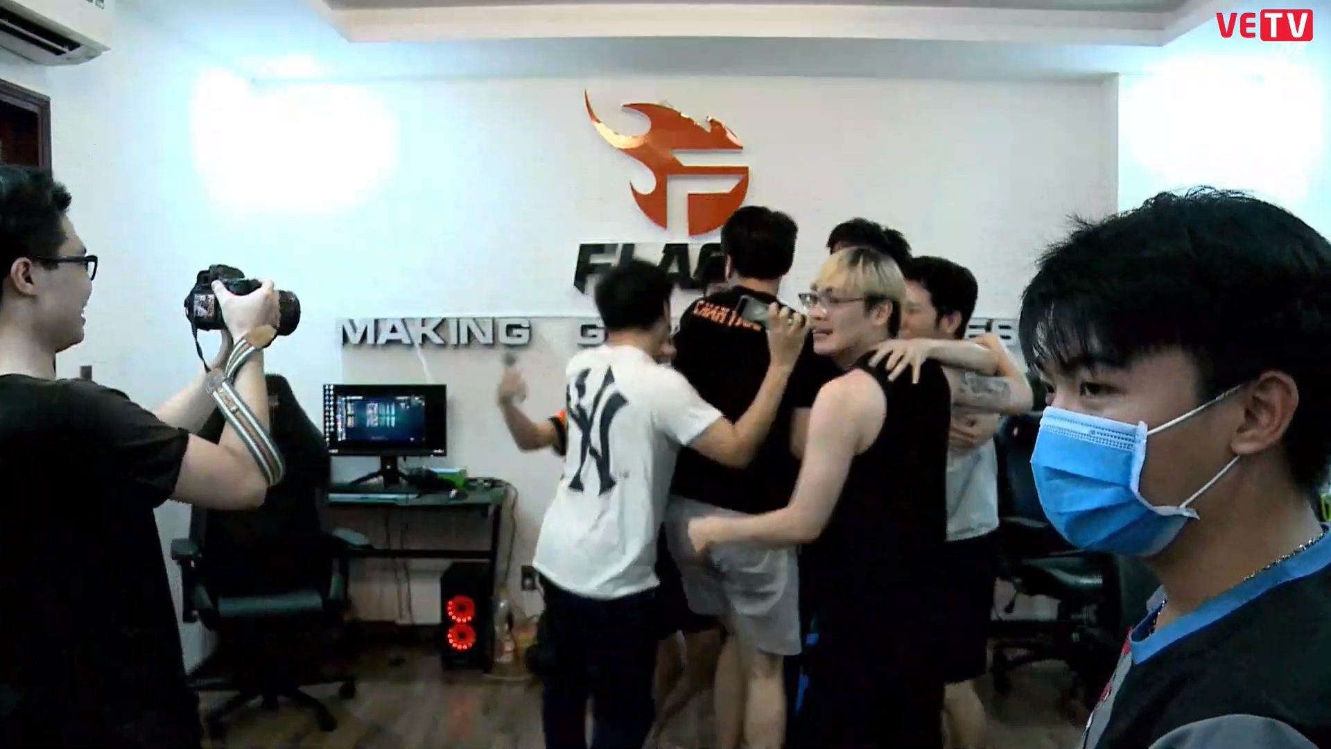 Team Flash players celebrate at the team's Gaming House after their historic achievement.