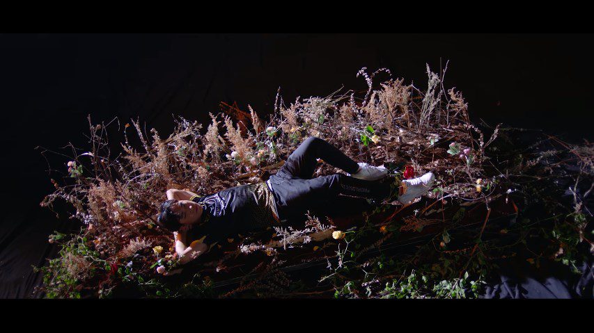 Levi appears at the beginning of the video in a distinctly 'sleeping beauty' style