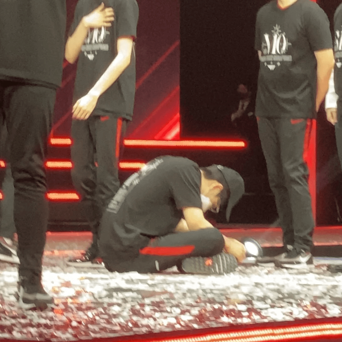 Oner sitting exhausted on the stage floor