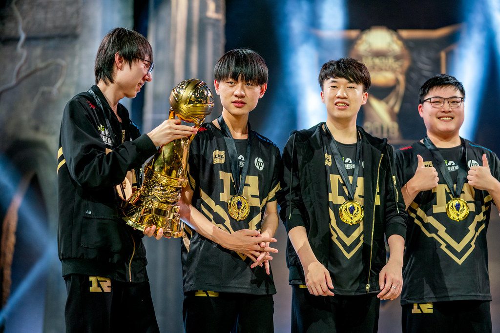 Despite being on the same team, Mlxg (holding the trophy) and Uzi (far right) have very different lives