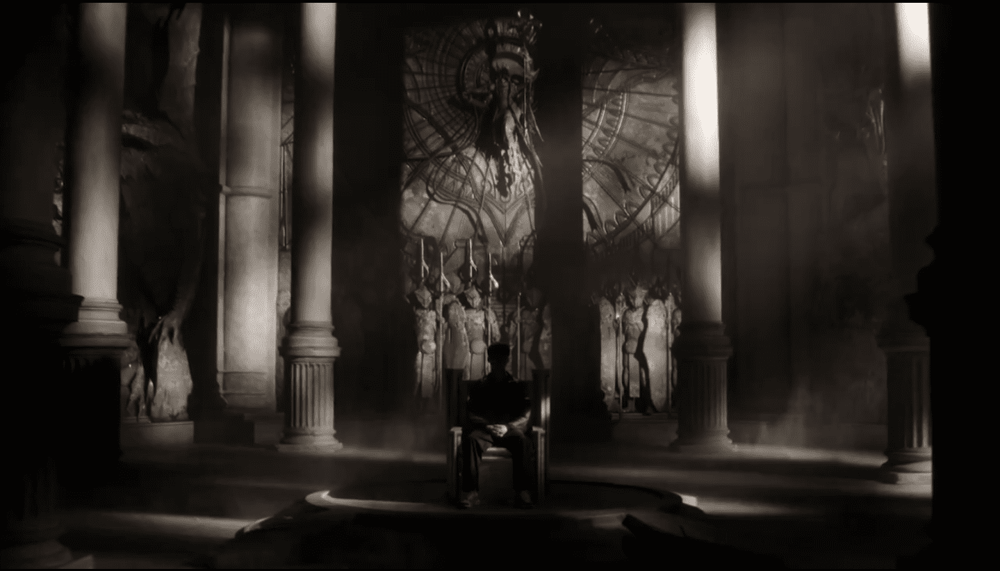 Faker sitting on a throne obscured in darkness with Azir and the sand soldiers of the Shurima Emperor behind him