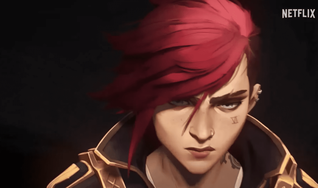 In the latest trailer, Vi is introduced as a member of the Piltover Enforcers, wearing their uniform and standing alongside Caitlyn