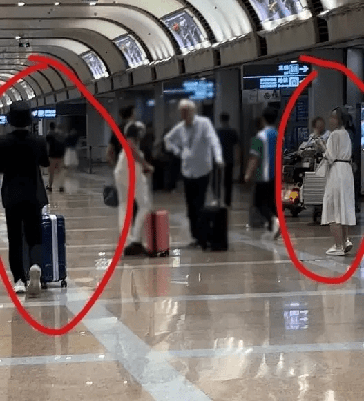 The girl in the white dress is believed to be Scout's girlfriend and a controversial staff member of LNG