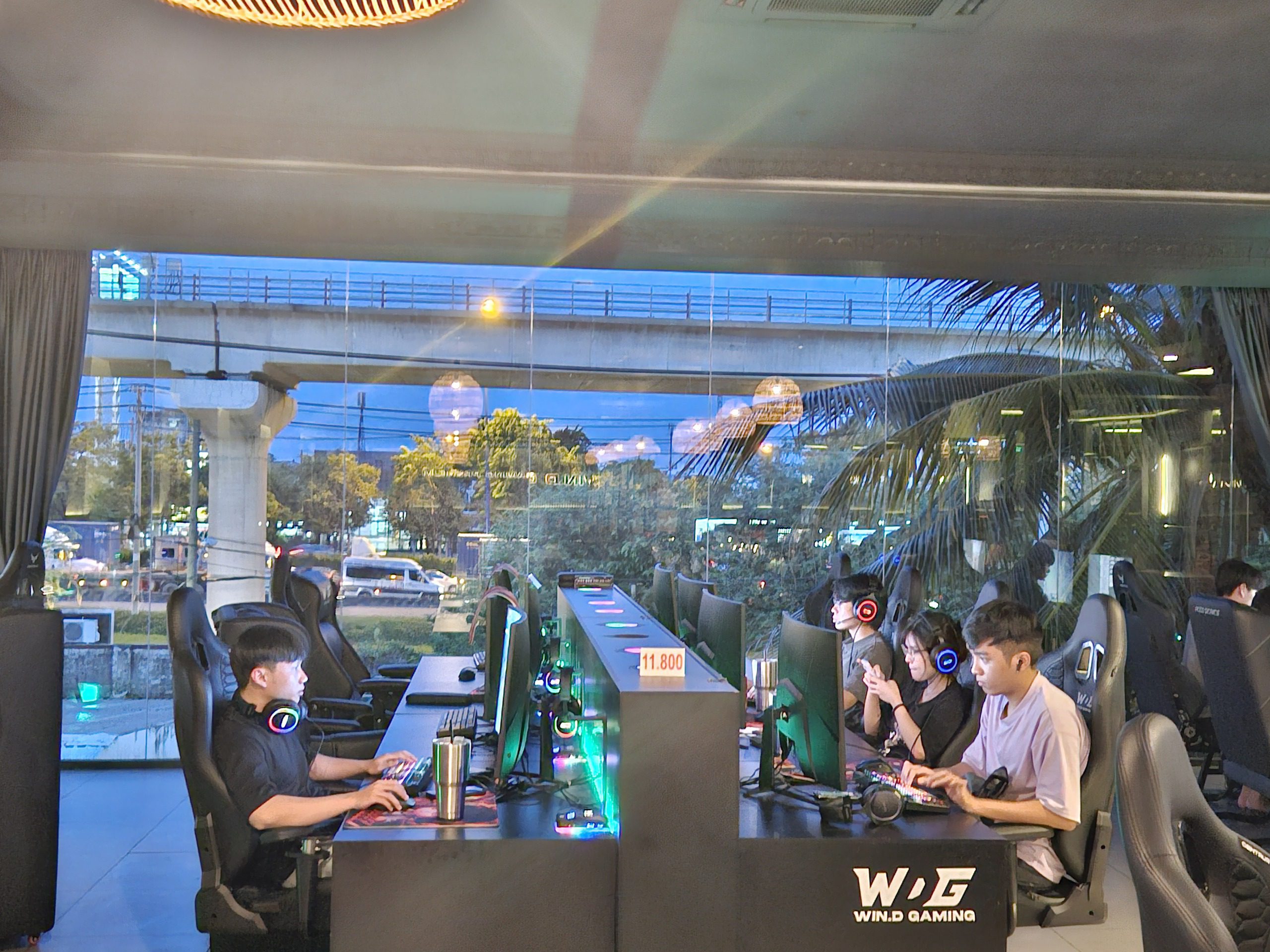 View of the cyber cafe overlooking Hanoi Highway and the Metro train tracks