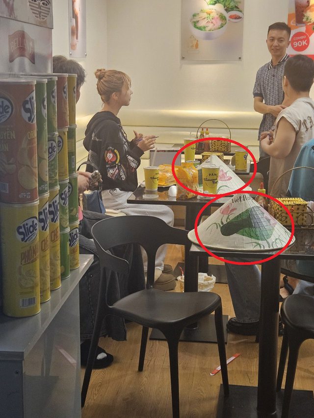 She experienced pho and traditional Vietnamese conical hats placed right beside her.